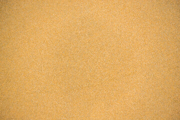 Fototapeta na wymiar Top view of sandy beach and visible sand texture.