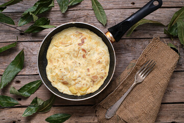 Freshly made potato omelette in frying pan
