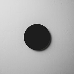 Black obsidian mirror on gray stone surface