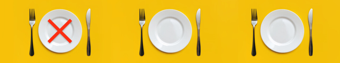 On the yellow tablecloth are three sets of white empty plates,stainless steel forks, knives.There is a red cross at the place of Breakfast.Minimum serving.Intermittent fasting, diet.Copy space, mockup