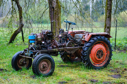 old broken tractor in the field