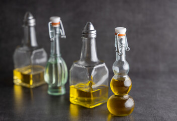 Variation of vegan cooking oils. Variation of trendy vegan cooking oils in a small jar on a table top .
