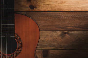 guitarra ac&uacute;stica con fondo de madera