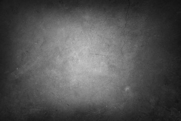 Grey textured concrete wall background. Dark edges