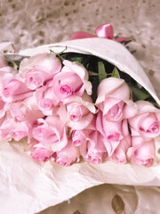 A bunch flowers of fresh light pink roses. Beautiful rose in a bud