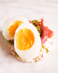 Simple open sandwiches on bread with egg and salmon. The concept of healthy eating.