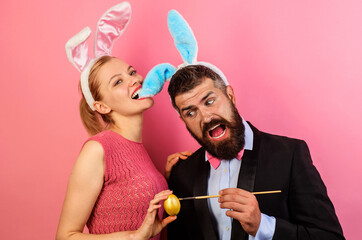 Couple painting eggs for Easter. Family celebrate Easter. Happy holidays in family.