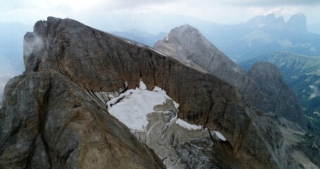 The Marmolada glacier in summer: Aerial view of the last and the only glacier of the Dolomites, UNESCO heritage, near the town of Canazei - August 2018 - Evidence of global warming and melting glacier