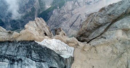 The Marmolada glacier in summer: Aerial view of the last and the only glacier of the Dolomites, UNESCO heritage, near the town of Canazei - August 2018 - Evidence of global warming and melting glacier
