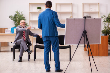 Fototapeta na wymiar Two male employees in business meeting concept