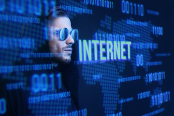 Beautiful stylish man on dark virtual reality background. Cryptocurrency, finance, future technology, innovative ideas concept. Futuristic holographic interface to display data.