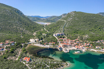 Aerial drone shot of Mali Ston village with City Wall of Ston in Ragusa near Dubrovnik in Croatia summer
