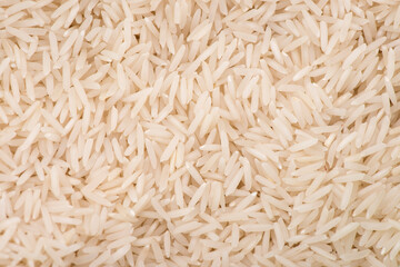 Heap of white rice isolated on black background. rice close-up.