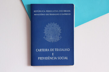 Translation: Federative Republic of Brazil, Ministry of Labor. / Brazilian Work Card (carteira de trabalho) on blue and white background. Formal job in Brazil.
