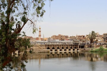 Fototapeta na wymiar The aqueduct of Assuit city showing Nile river and buildings in the background in Egypt