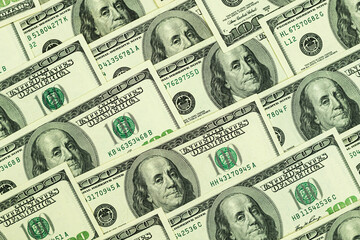 Money background, dollar banknotes, a pile of one hundred US dollar banknotes