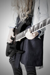 young girl with an electric guitar - close up