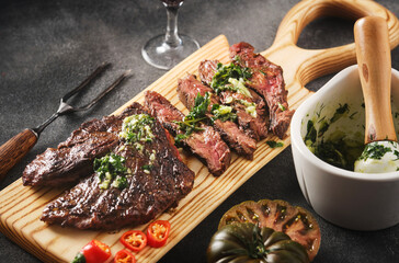 Hanger steak bbq with souce chimichurri, close up - 417469197