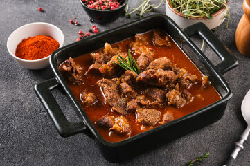 Goulash traditional Hungarian Beef Meat Stew or Soup with vegetables and tomato and paprika sauce.