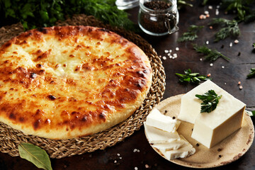 National Caucasian dish - Ossetian pies with cheese, potatoes, herbs, cottage cheese, beef, mushrooms