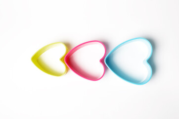 colored plastic bakeware on white background