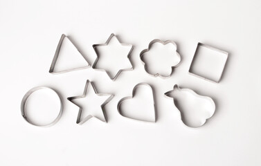 metal cookie cutters on white background