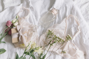 Happy Women's day. Stylish lingerie,jewelry, gift, perfume and spring flowers. Soft trendy image
