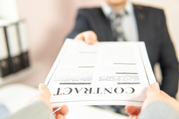 businessman takes a contract. partial focus. close-up.