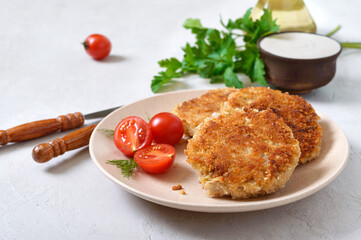 Vegetarian pancakes with cabbage on a plate with sour cream. Diet menu.