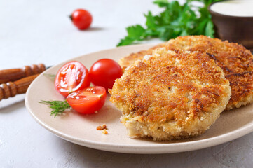 Vegetarian pancakes with cabbage on a plate with sour cream. Diet menu.