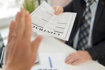 partial focus. businessman refuses a contract that is handed to him. high quality