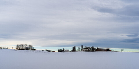 Fototapeta premium Farms in winter at Toten, Norway.