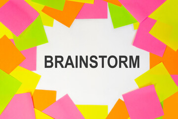 Text brainstorm clue on a white background. Multicolored stickers around