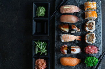 Obraz na płótnie Canvas Japanese sushi set - Various Maki sushi roll and nigiri sushi. Japanese food 