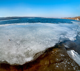 ice melts on the pond, the awakening of nature, early spring, March. Wide angle