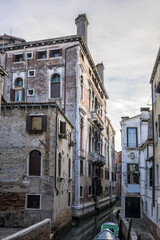 Fototapeta na wymiar View of old traditional buildings located near the canal. Venice, Italy.