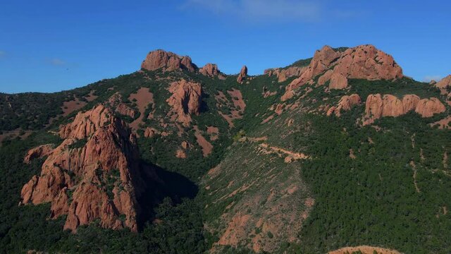 Aerial shots of the red mountains of the Massif de L'essterel in France..