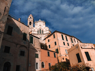 Liguria, Italy - March, 01, 2021 - Old buildings and bridges from the small Ligurian villages. Roman and medieval architecture with seaside in the background. Beautiful landscape of a coastal fishing.