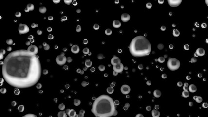 Water droplets are falling in slow motion on a dark background. Macro shot with shallow depth of field.