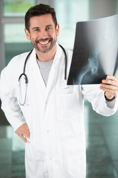 doctor man looking at x-ray radiography doing body examination