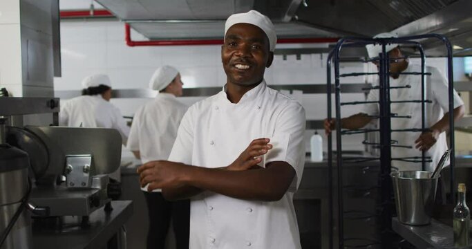 Portrait of african american male chef with arms crossed looking at camera