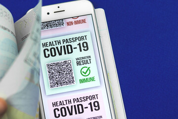 Health passport app close up, traveler shows digital documents with COVID-19 test result, conceptual photo
