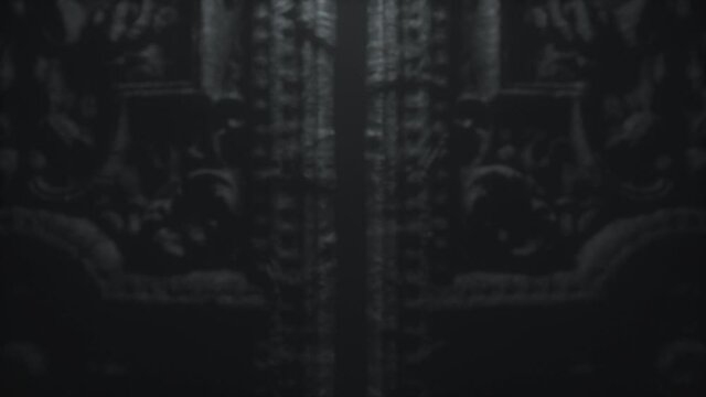 Old gothic stone door to hell with patterns. The doors open. Moving the camera forward. 3d animation of 4K