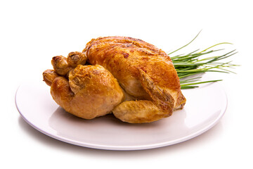 Baked chicken and herbs on a white plate. Isolate on white background