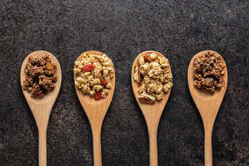 Various breakfast cereals. Morning granola in wooden scoop.