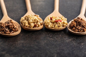 Various breakfast cereals. Morning granola in wooden scoop.