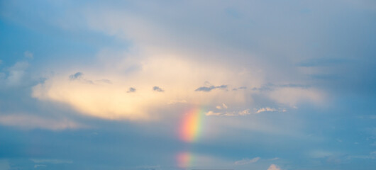 Naklejka na ściany i meble natural phenomenon - a beautiful rainbow in the sky after rain