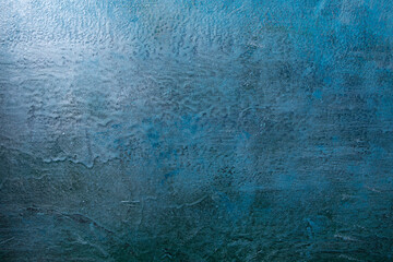 Painted different shades of blue on the wall. Abstract blue background