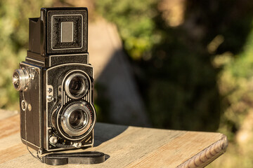 old camera on a wooden table