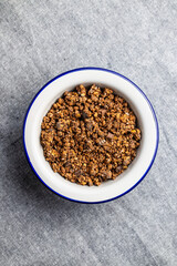 Chocolate breakfast cereal. Morning granola in bowl.